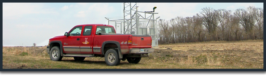 Rural Tower Network truck by tower closeup