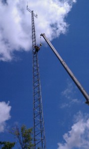 Worker climbing newly rebuilt Krub tower - Rural toer Network